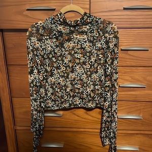 Brand: Free people Style: Multi colored blouse with cut out in back Size: S
